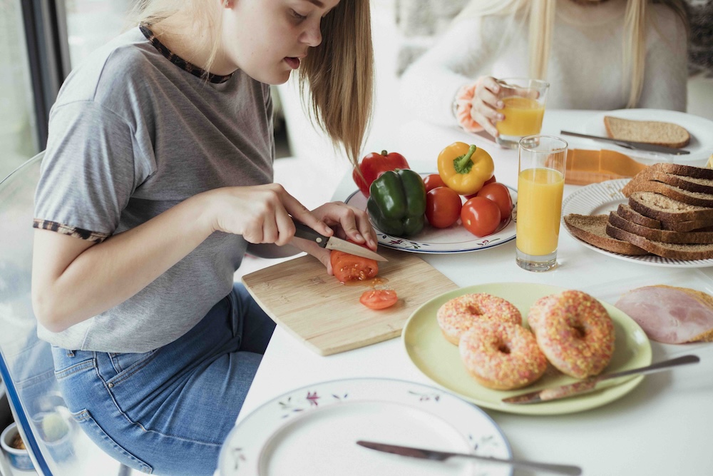 Girl preparing vegetables for cooking